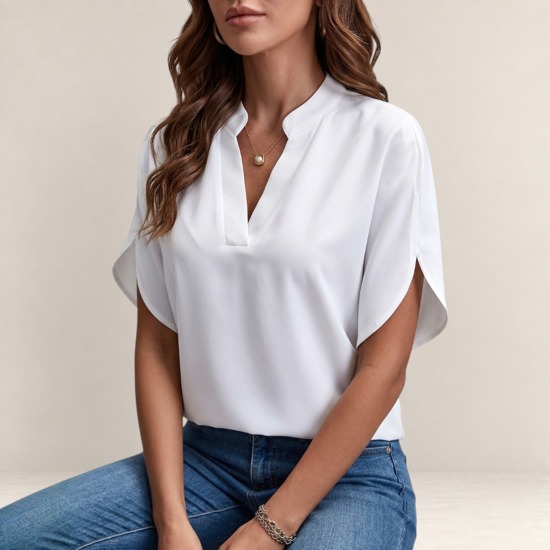Valvet Oak House Agatha white blouse with a structured collar and short sleeves worn with blue jeans