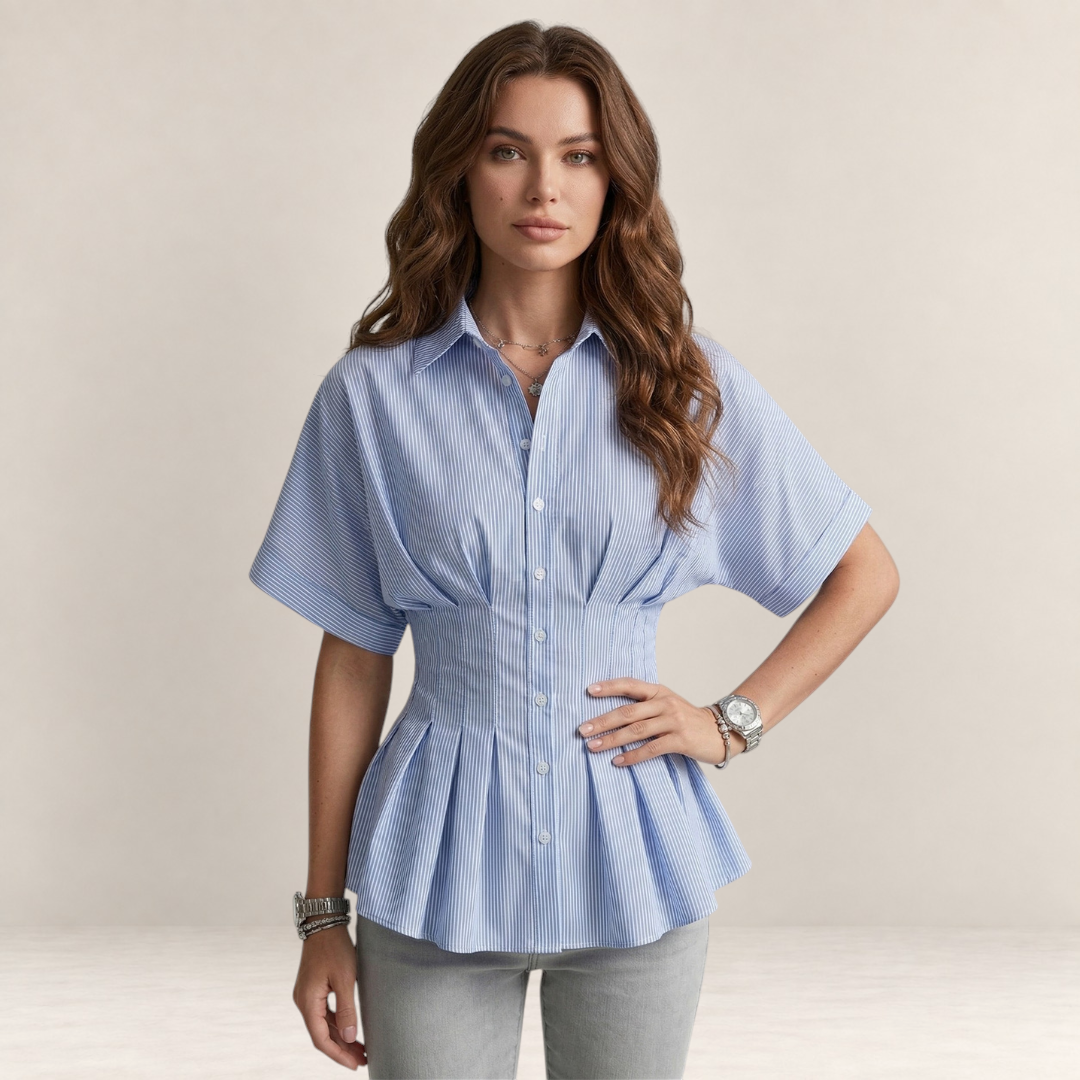 Valvet Oak House Pietra blue and white striped short-sleeve button-down blouse with a cinched waist on a model