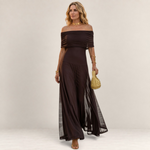 Valvet Oak House Chloe off-the-shoulder dark brown maxi dress worn by a blonde model with gold jewelry