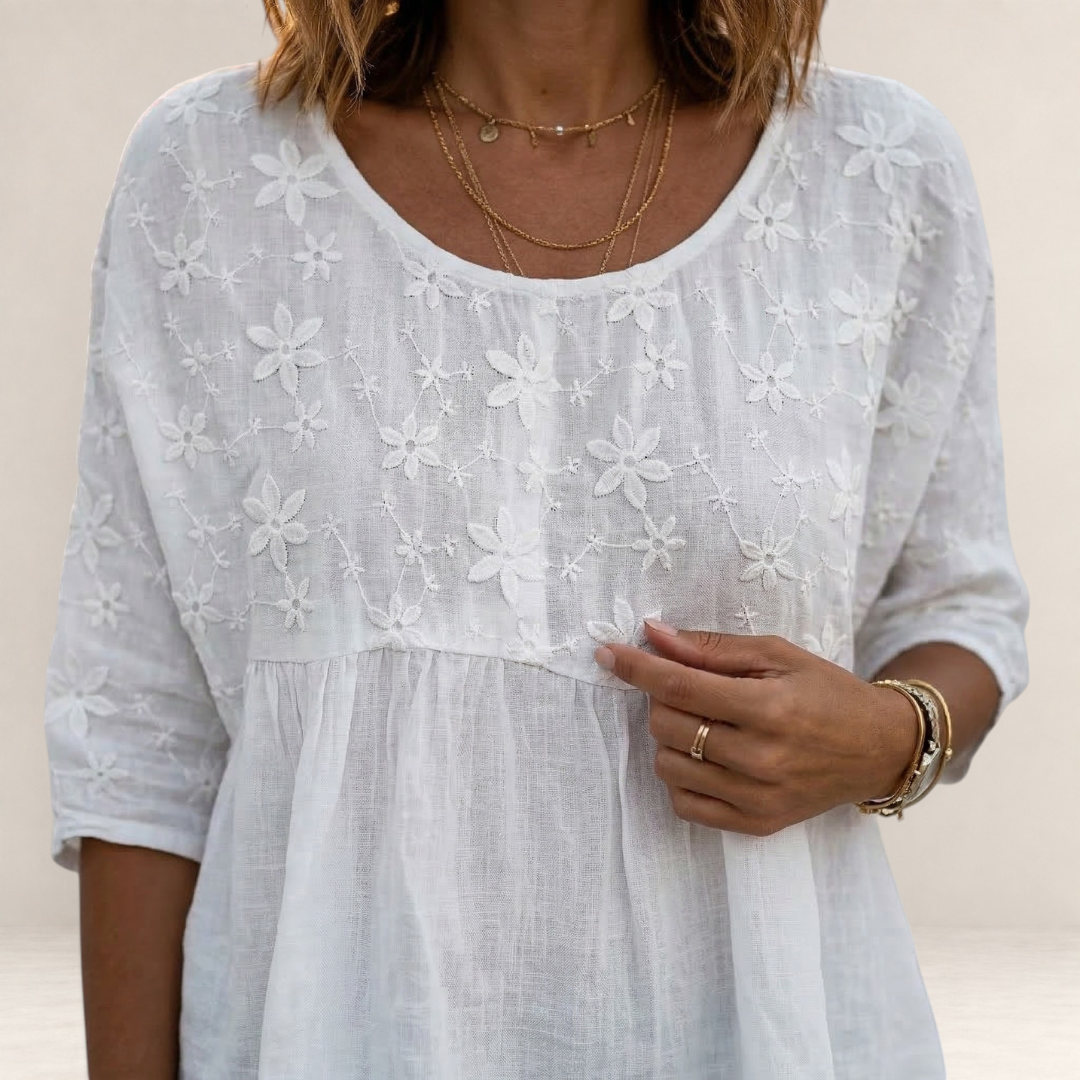 Valvet Oak House white blouse featuring delicate floral embroidery and a relaxed patchwork-inspired design