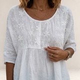 Valvet Oak House white blouse featuring delicate floral embroidery and a relaxed patchwork-inspired design