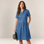 Valvet Oak House Neusa denim dress with button-down front and short sleeves worn by a model holding a green hat