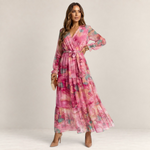 Valvet Oak House pink floral maxi dress with a wrap-style bodice, long sleeves, and a tiered skirt on a model.