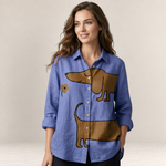Valvet Oak House blue linen button-down shirt featuring a playful brown dachshund print and wooden buttons.