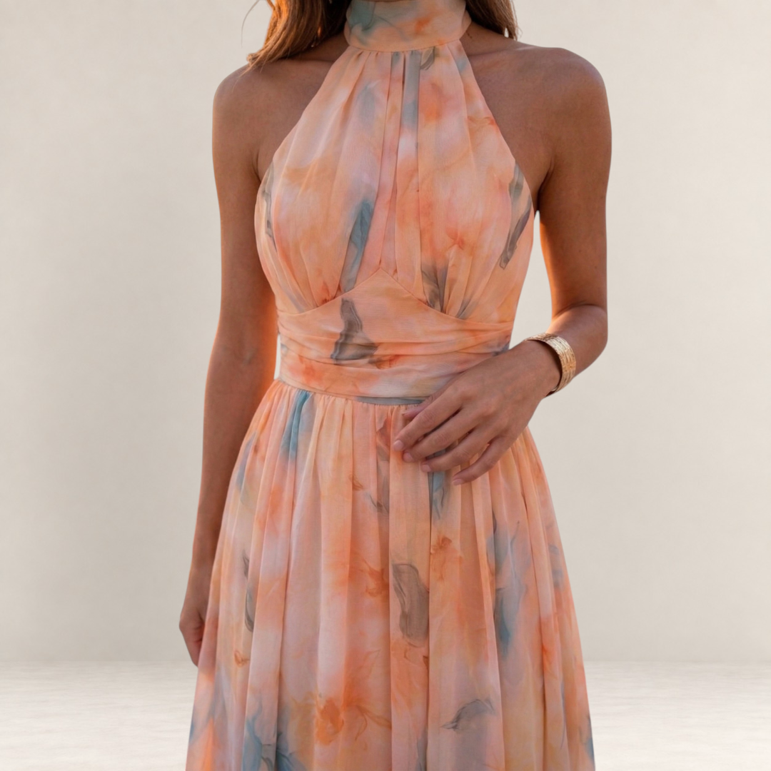 Valvet Oak House silk maxi dress with a halter neckline in a peach and blue floral watercolor print