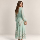 Valvet Oak House Mel midi dress in mint green pleated chiffon with floral print, long sleeves, and elegant silhouette