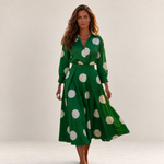 Valvet Oak House Lana green midi dress with white polka dots, featuring a collar and long sleeves on a model