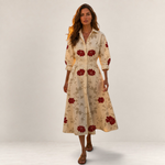 Valvet Oak House Lana cotton midi dress in cream with red floral embroidery, featuring a collar and long sleeves.