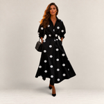 Valvet Oak House Lana black cotton midi dress with white polka dots, collar, and long sleeves worn by a model.