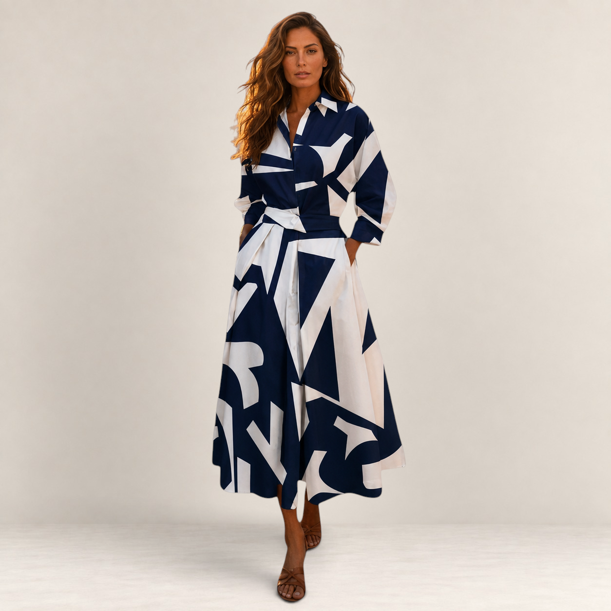 Valvet Oak House Lana cotton midi dress with a navy and white geometric print, collar, and side pockets on a model.