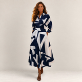 Valvet Oak House Lana cotton midi dress with a navy and white geometric print, collar, and side pockets on a model.