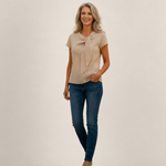 Valvet Oak House Hera beige linen short-sleeve blouse with neck detail worn by a woman with blue jeans