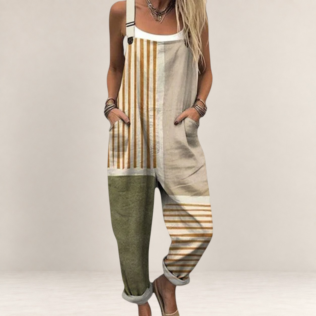 Valvet Oak House loose-fit printed jumpsuit with wide legs, adjustable straps, and side pockets in neutral tones.