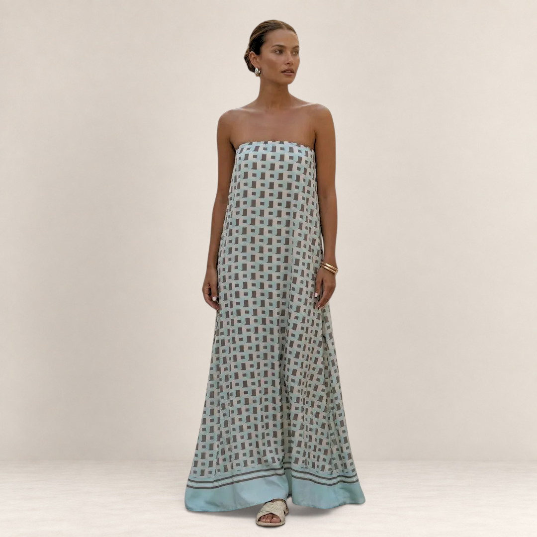 Valvet Oak House strapless maxi dress featuring a light blue and geometric pattern on a model against a neutral wall