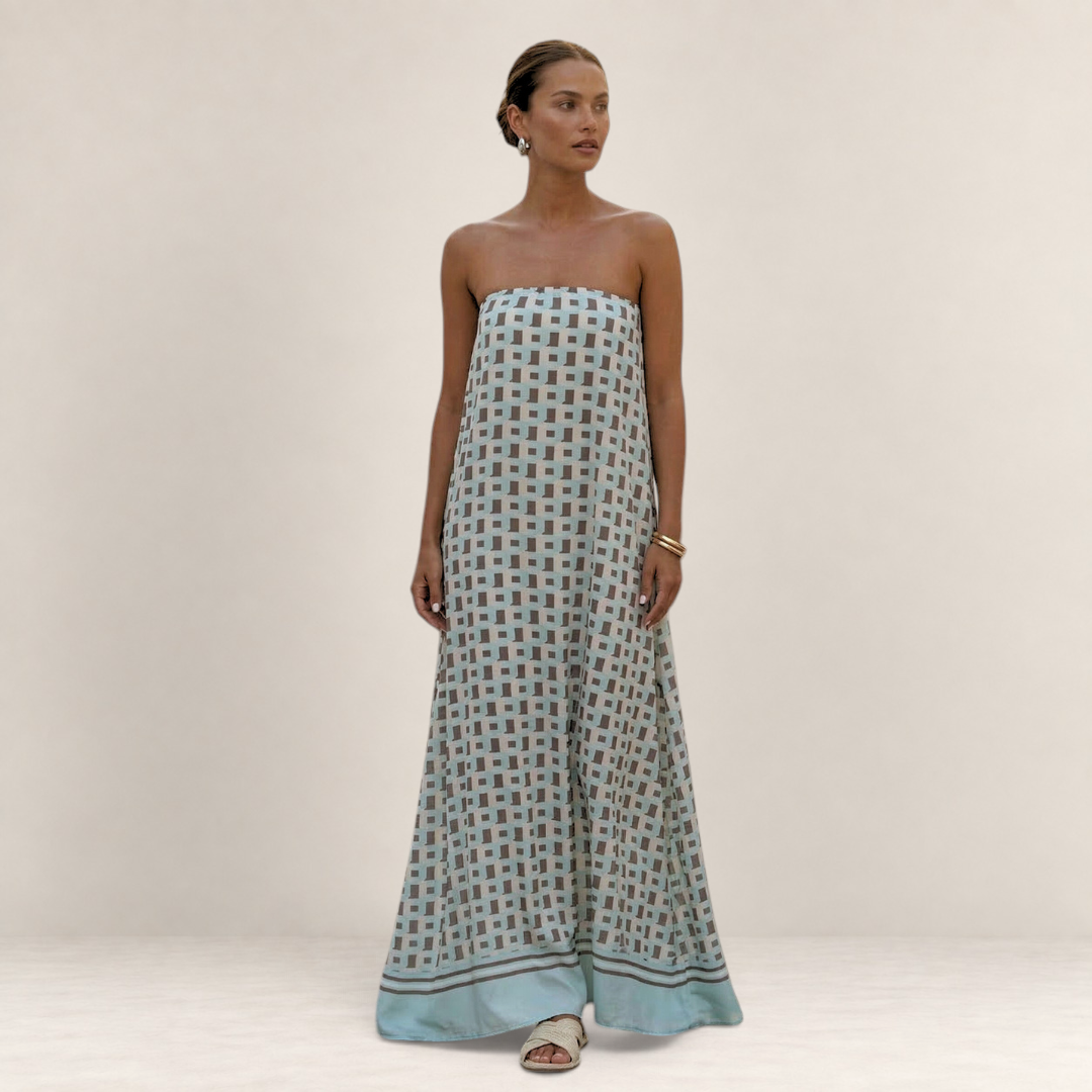 Valvet Oak House Iris strapless maxi dress featuring a light blue and brown geometric pattern on a flowing silhouette.