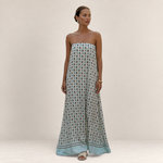 Valvet Oak House Iris strapless maxi dress featuring a light blue and brown geometric pattern on a flowing silhouette.