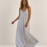 Valvet Oak House Safira white A-line summer maxi dress with thin straps worn by a smiling woman