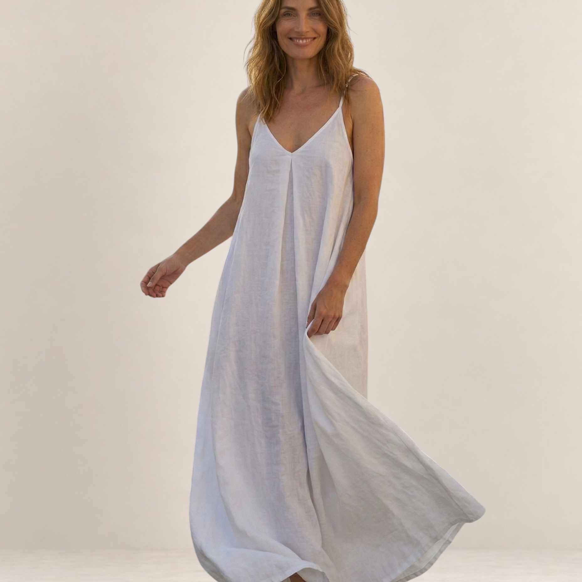 Valvet Oak House Safira white A-line summer maxi dress with thin straps worn by a smiling woman