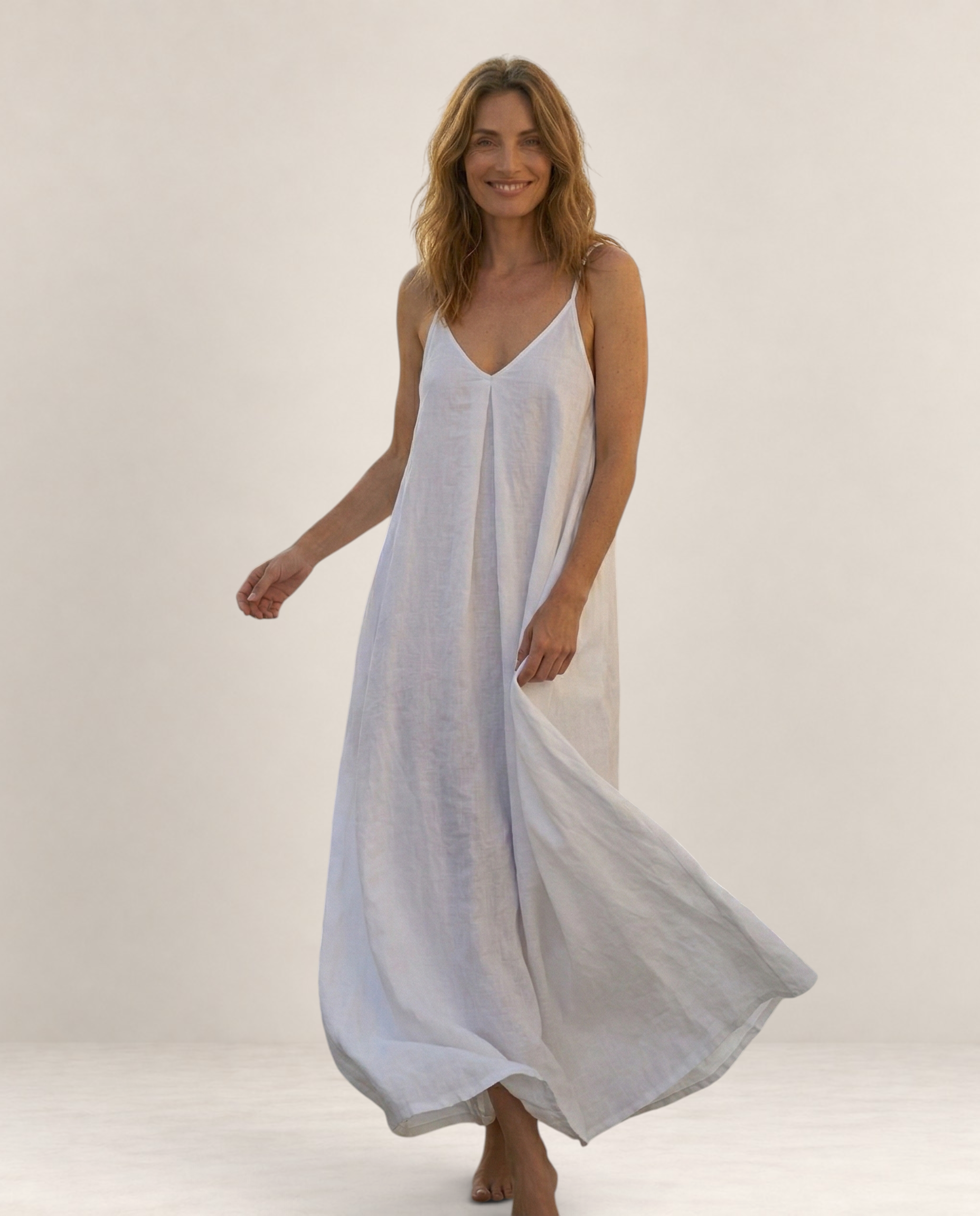Valvet Oak House Safira white A-line summer maxi dress with thin straps worn by a smiling woman