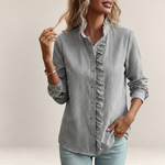 Valvet Oak House striped button-down shirt with ruffle detail on a woman wearing light blue jeans
