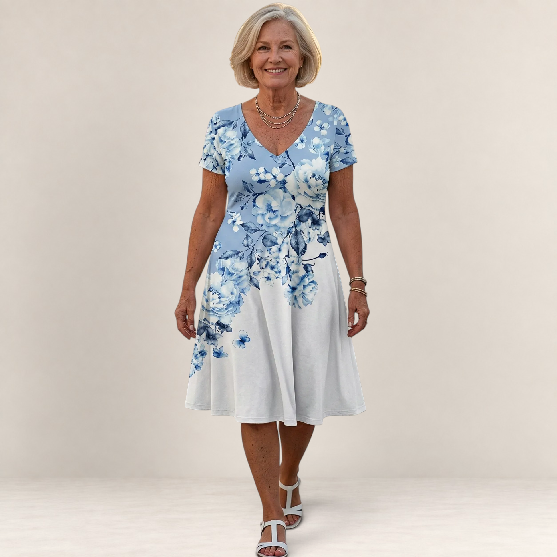 Valvet Oak House Leda floral print dress with V-neck and short sleeves worn by a smiling woman