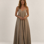 Valvet Oak House Safira beige maxi summer dress with thin straps and A-line silhouette worn by a smiling woman