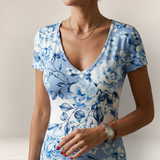 Valvet Oak House Leda dress featuring a blue and white floral pattern with a V-neck and short sleeves