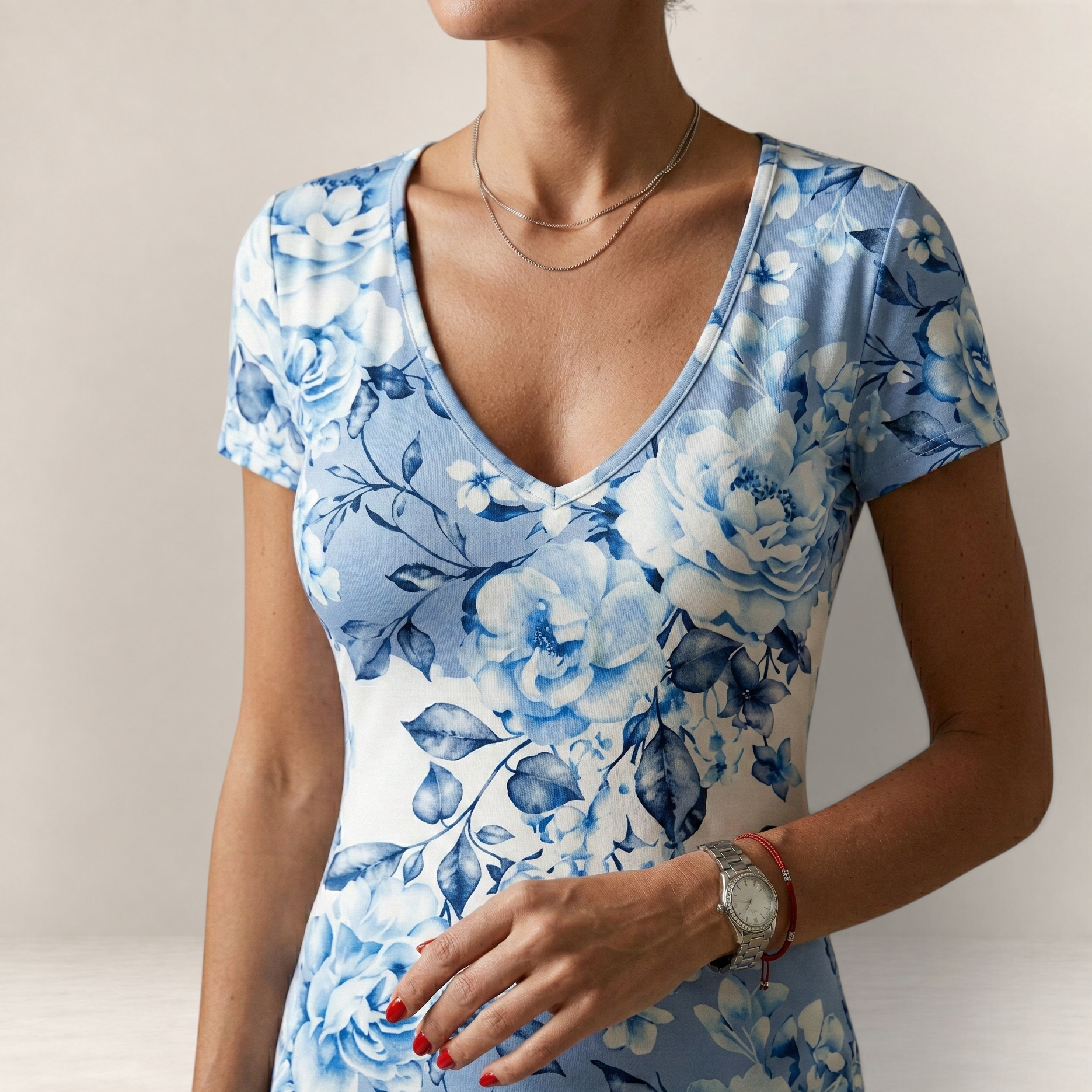 Valvet Oak House Leda dress featuring a blue and white floral pattern with a V-neck and short sleeves