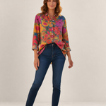 Valvet Oak House Anastasia shirt in vibrant floral print Tencel fabric worn by a model with dark blue jeans