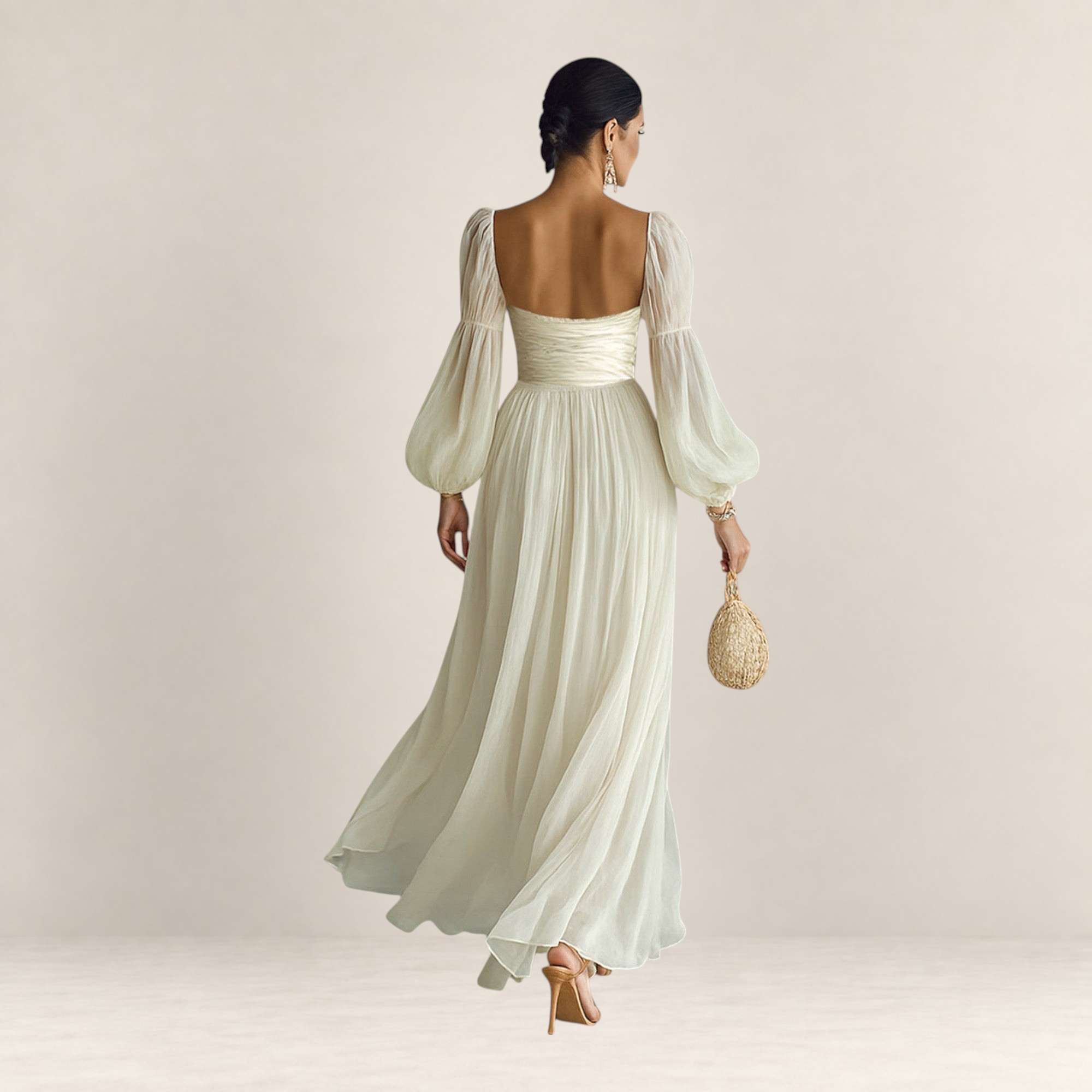 Valvet Oak House romantic cream maxi dress with long puff sleeves and a flowing skirt, back view