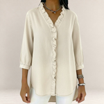 Valvet Oak House Elena beige blouse with delicate ruffles, V-neck, and three-quarter sleeves on a model