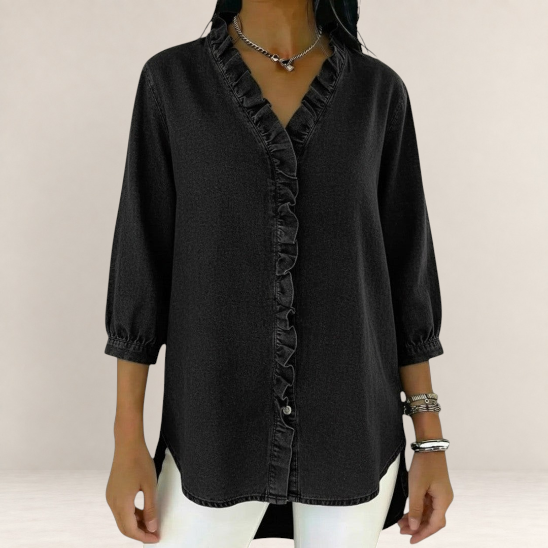 Valvet Oak House black denim blouse featuring a V-neckline with delicate ruffles and three-quarter length sleeves.