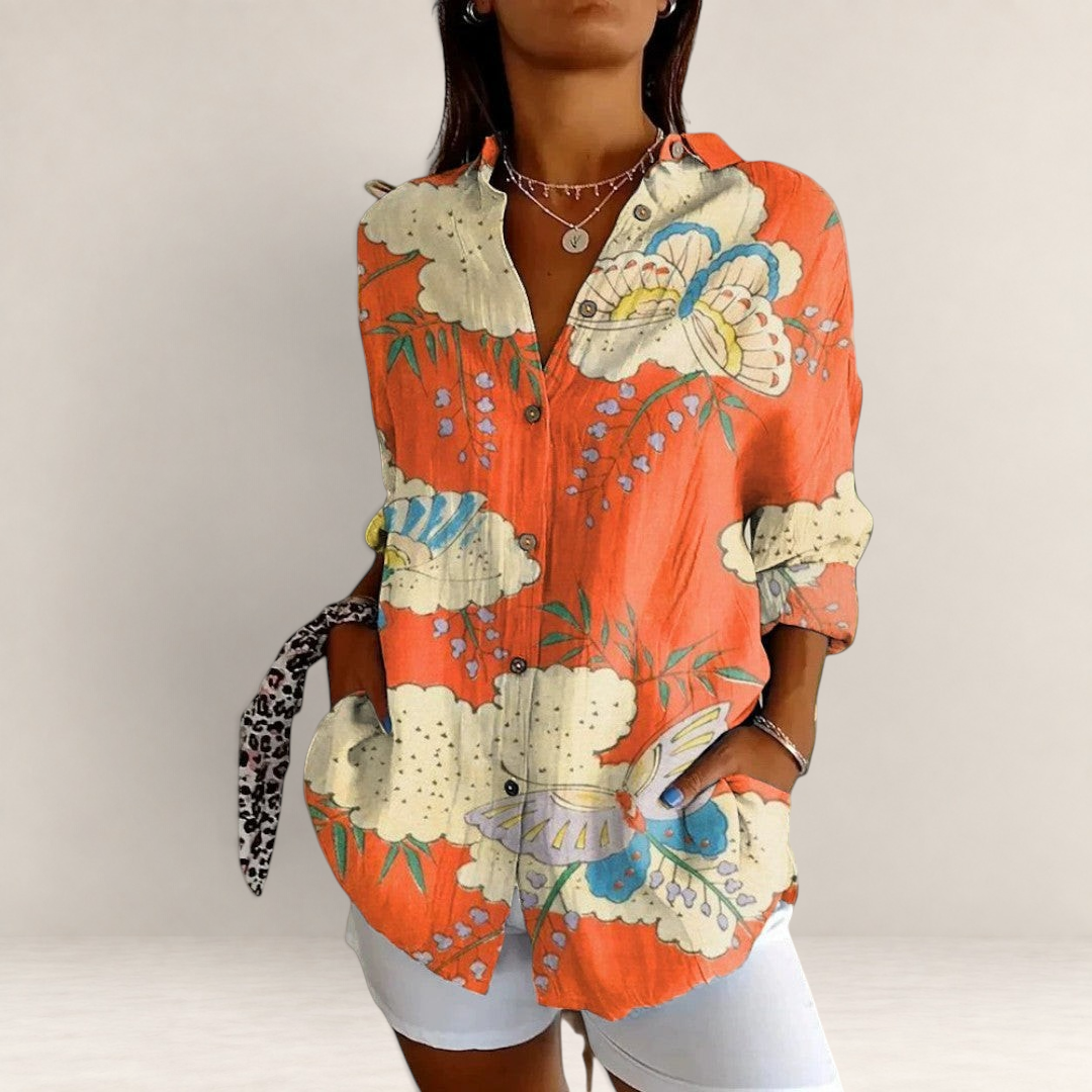 Valvet Oak House long-sleeve button-down shirt in orange with vibrant floral and butterfly patterns