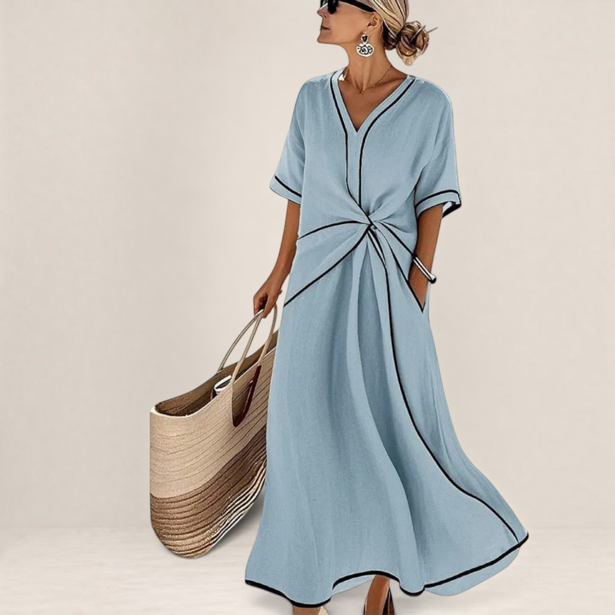 Valvet Oak House Mila light blue midi dress with V-neck, contrast black piping, and a flattering twisted waist detail.