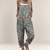 Valvet Oak House grey floral print loose-fit jumpsuit with wide legs and adjustable straps on a woman