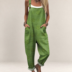 Valvet Oak House green printed wide-leg jumpsuit with adjustable straps and side pockets worn over a white top