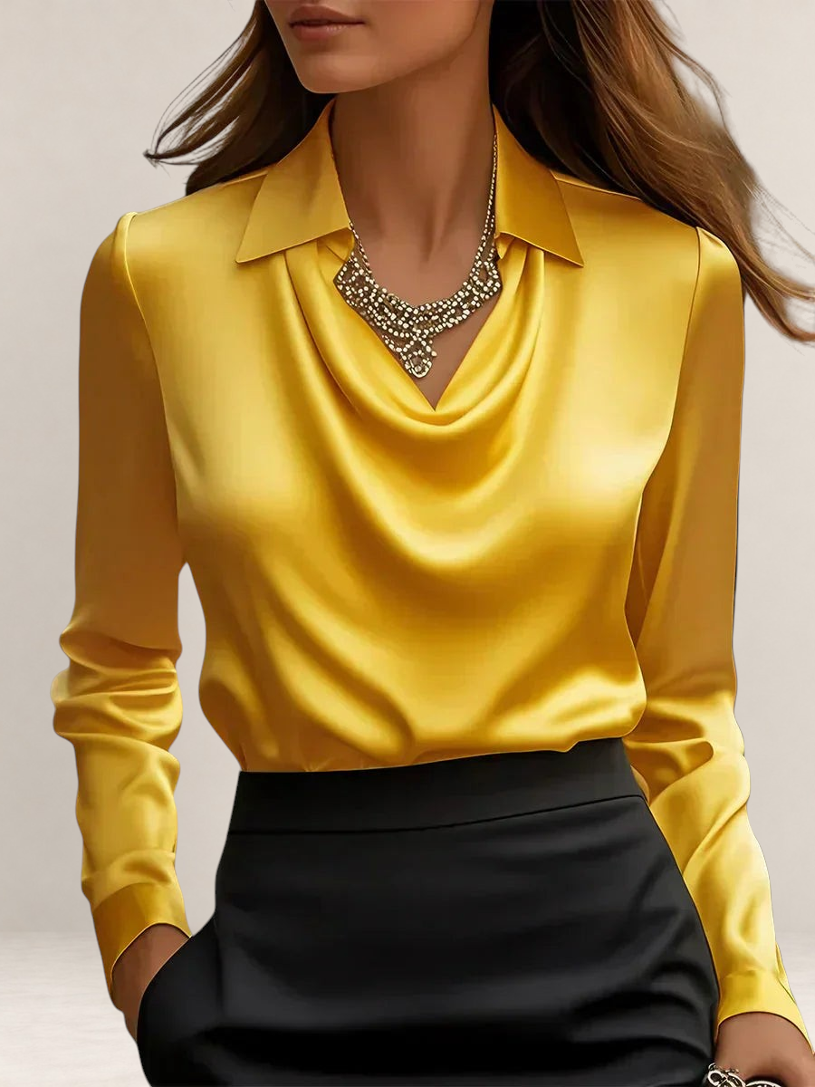 Valvet Oak House yellow satin blouse with a draped cowl neckline and classic collar worn with a black skirt