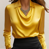 Valvet Oak House yellow satin blouse with a draped cowl neckline and classic collar worn with a black skirt