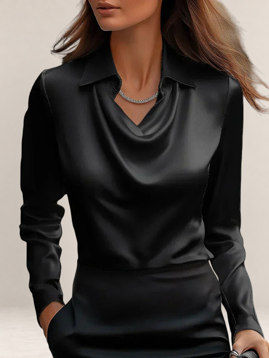 Valvet Oak House black satin blouse with a draped neckline and classic collar worn by a woman
