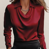 Valvet Oak House elegant deep red satin blouse with a draped neckline and classic collar worn by a woman