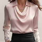 Valvet Oak House elegant pale pink satin blouse with a draped cowl neckline and classic collar worn with a skirt.