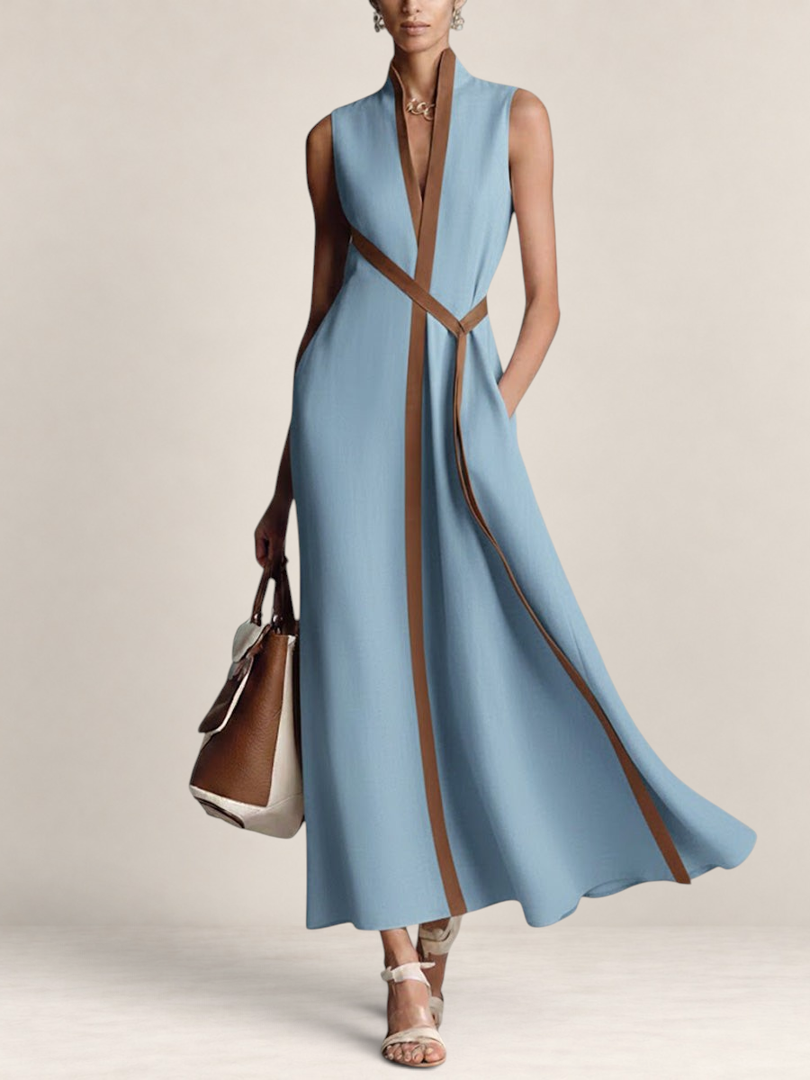 Valvet Oak House light blue linen blend maxi dress with a brown trim, stand-up collar, and a matching waist tie.