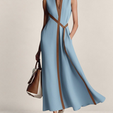 Valvet Oak House light blue linen blend maxi dress with a brown trim, stand-up collar, and a matching waist tie.