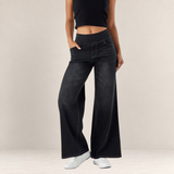 Valvet Oak House black wide-leg trousers with an elastic waistband and casual stretch fit worn with a black crop top