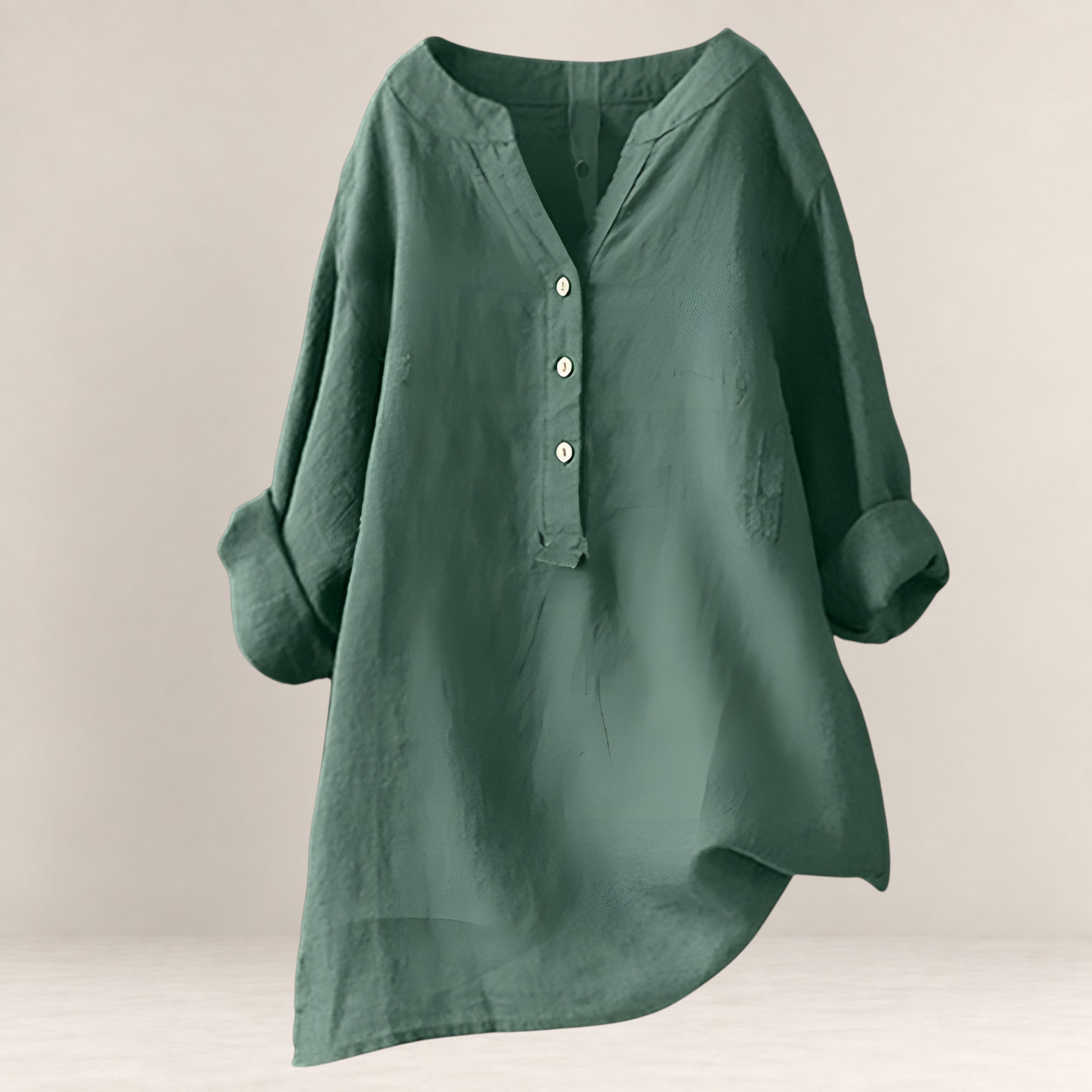 Valvet Oak House Edna green linen and cotton blend blouse with a relaxed fit, V-neck, and button-down front.