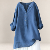 Valvet Oak House Edna blue linen and cotton blend blouse with a V-neck and button-down front, hanging on a hanger.