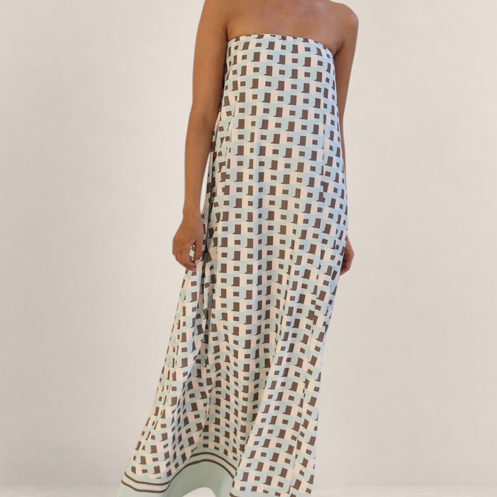 Valvet Oak House Iris strapless maxi dress featuring a light blue and brown geometric pattern on a flowy silhouette.