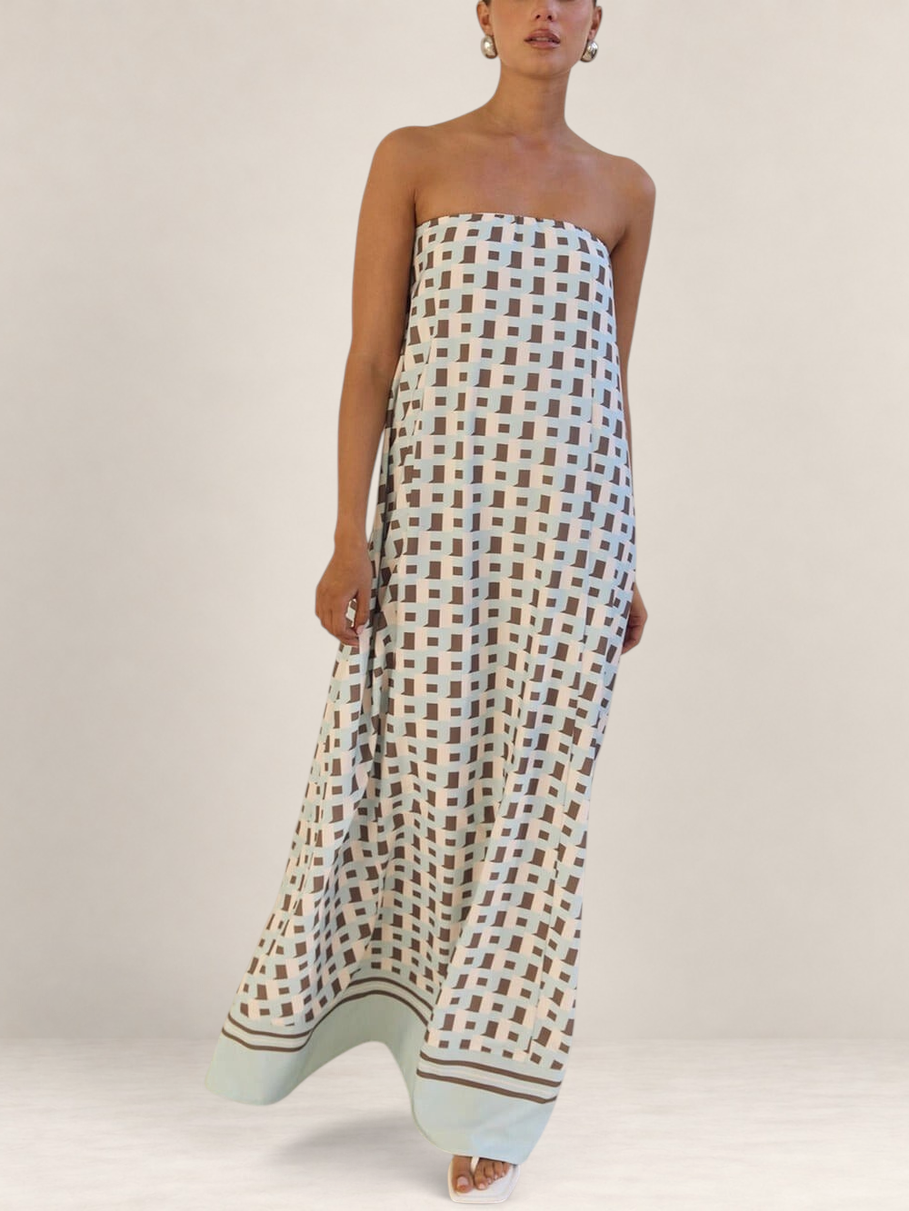 Valvet Oak House Iris strapless maxi dress featuring a light blue and brown geometric pattern on a flowy silhouette.
