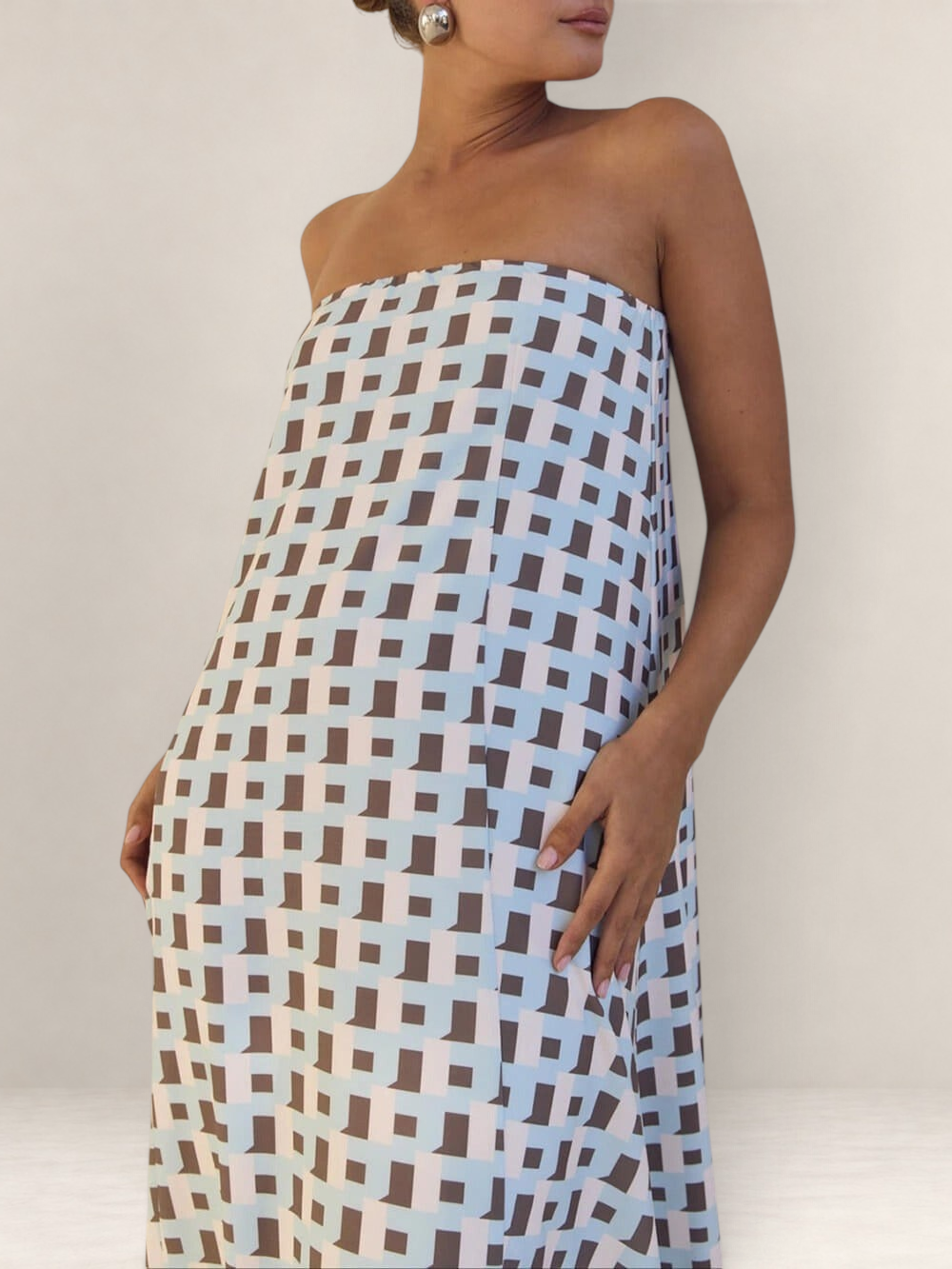 Valvet Oak House Iris strapless midi dress featuring a light blue and brown geometric pattern on a neutral background