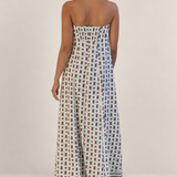 Valvet Oak House strapless maxi dress with geometric patterns in blue and brown, back view on a model